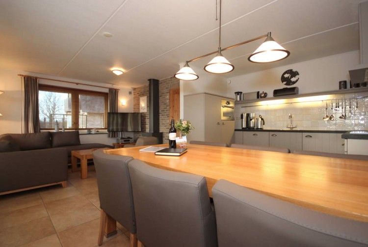 Cozy dining room in 6 pers. luxury wheelchair friendly villa, De Cocksdorp, Texel with modern kitchen.