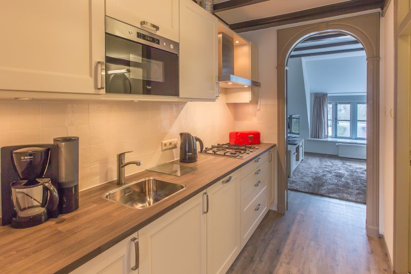 Moderne Kueche im Typ X-7 Ferienhaus De Cocksdorp Texel mit Einbaugeraeten