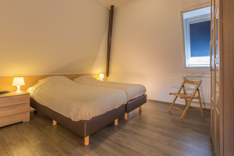 Bedroom with double bed in Type T-3 vacation home, De Cocksdorp, Texel.