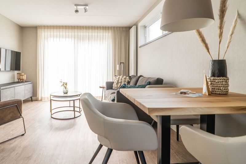 Modern living room in Type D Kikkertstraat, De Cocksdorp, Texel, with stylish furnishings and lots of natural light.