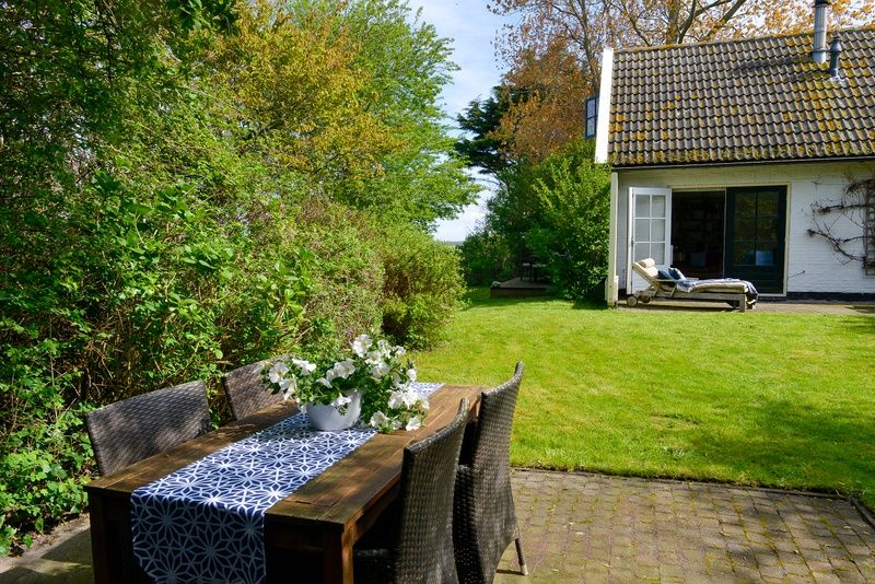 Cozy terrace at Het Wulpenlied vacation home in De Cocksdorp, Texel.