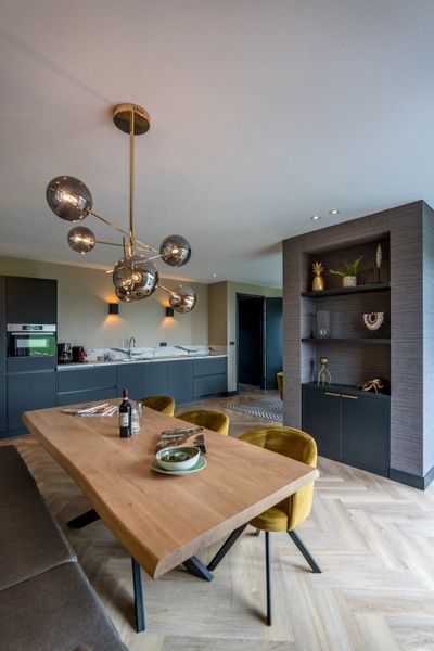 Dining room in 6 person vacation home in De Cocksdorp Texel with luxury wooden dining table.