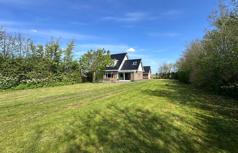 Spacious lawn at Holiday home in De Cocksdorp, Texel, Wadden Islands, perfect for outdoor activities.