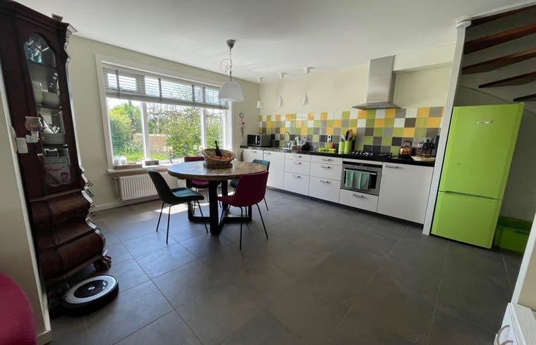 Modern kitchen in Holiday home in De Cocksdorp, Texel, Wadden Islands with colorful tiles.