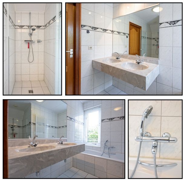 Stylish bathroom with shower and bath in Holiday home Schelpenoord 121, De Cocksdorp Texel.