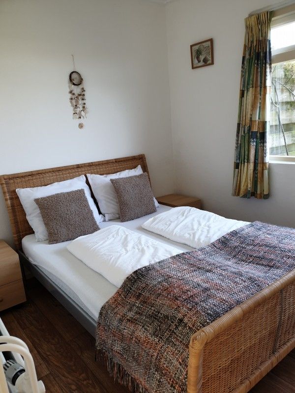 Attractive bedroom with double bed at Family Bouthoorn in Zuid-Eierland, Texel.