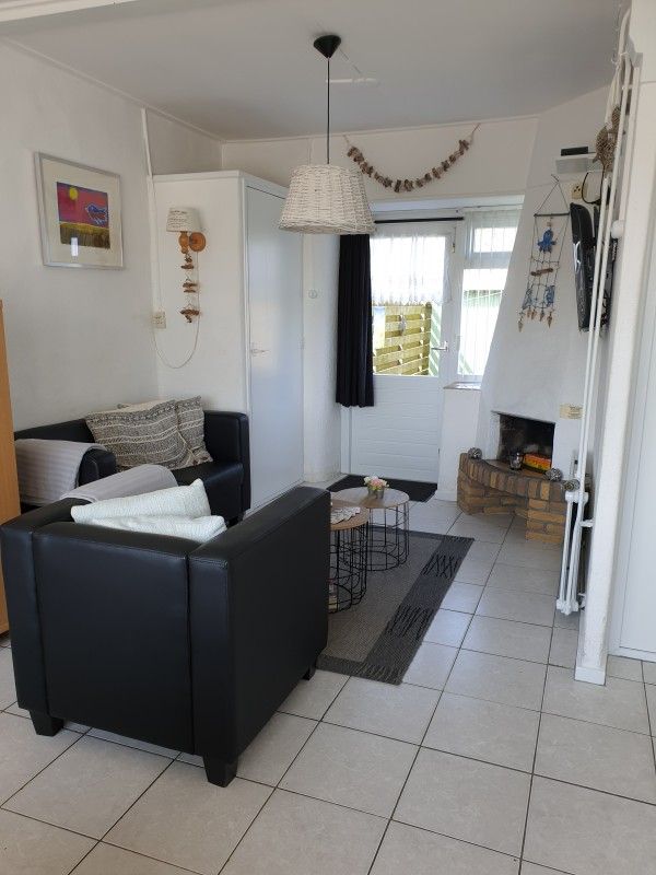 Intimate sitting area with decorative elements at Family Bouthoorn in Zuid-Eierland, Texel.