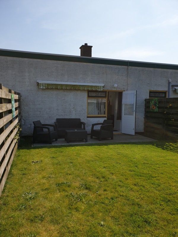 Private garden with sitting area at Holiday homes Family Bouthoorn in Zuid-Eierland, Texel.