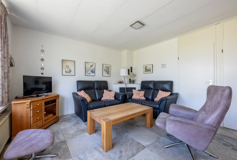 Stilvolle Sitzecke im Ferienhaus Slufterhoek 078, De Cocksdorp, ideal zum Entspannen.