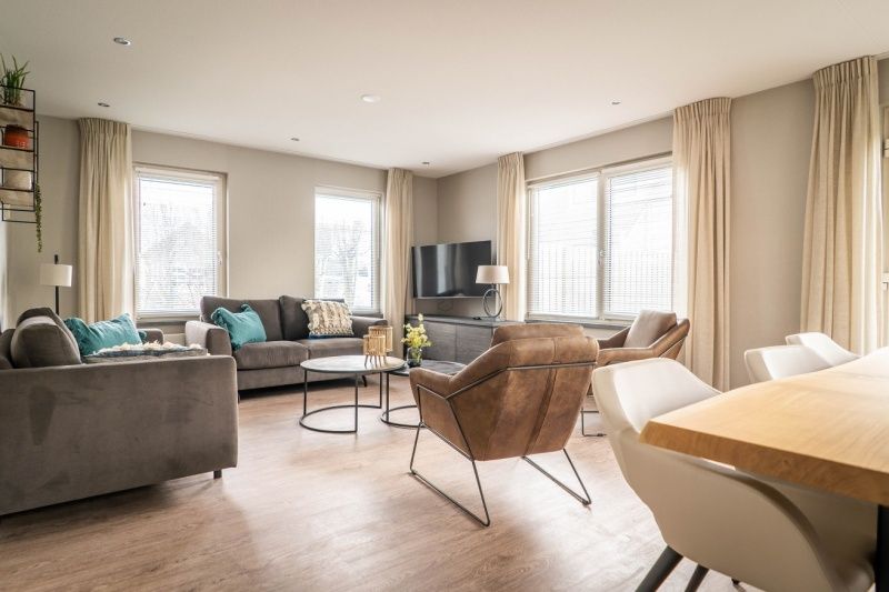 Cozy living room in Type B-10 Hodshonstraat vacation home, De Cocksdorp, Texel, ideal for relaxation on the Wadden Islands.