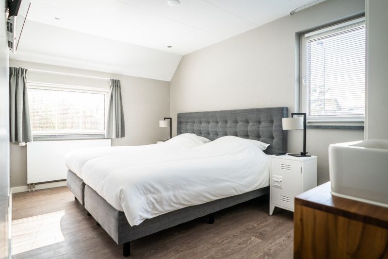 Comfortable bedroom in Type B-10 Hodshonstraat vacation home, De Cocksdorp, Texel, restful nights on the Wadden Islands.