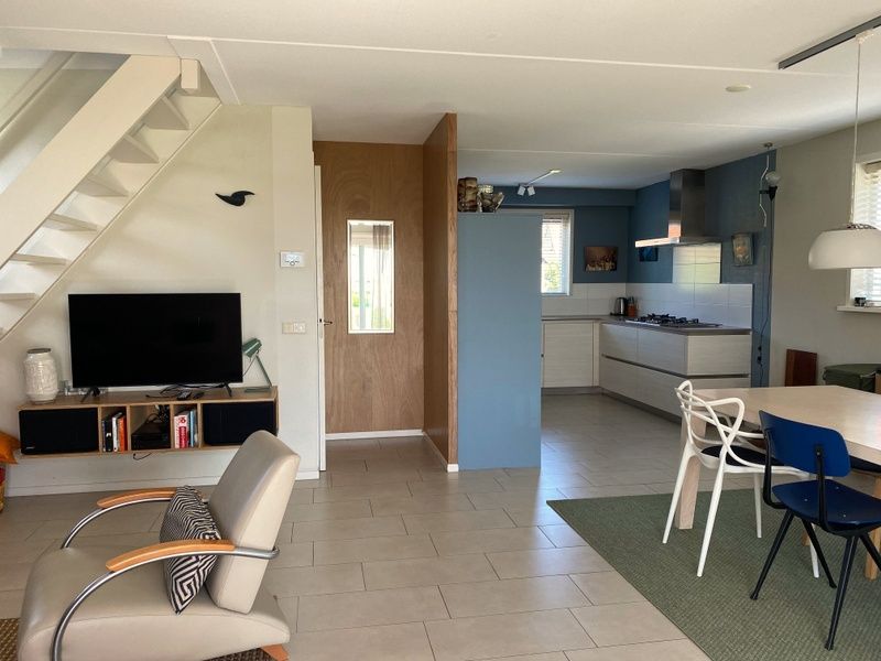 Modern kitchen and dining area in Frederik and Lodevika vacation home, De Cocksdorp, Texel.
