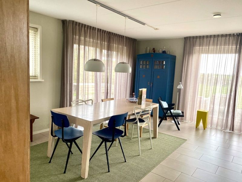 Dining area with view in Frederik and Lodevika vacation home, De Cocksdorp, Texel, Wadden Islands.