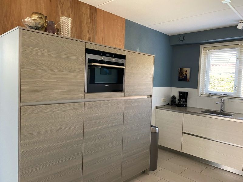 Bedroom with balcony in Frederik and Lodevika vacation home, De Cocksdorp, Texel.