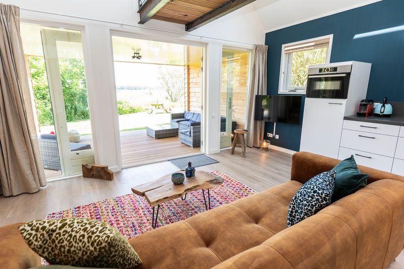 Blick auf die Veranda vom Wohnzimmer der Zeewinde, De Cocksdorp, Texel. Geniessen Sie die Natur der Waddeninseln.