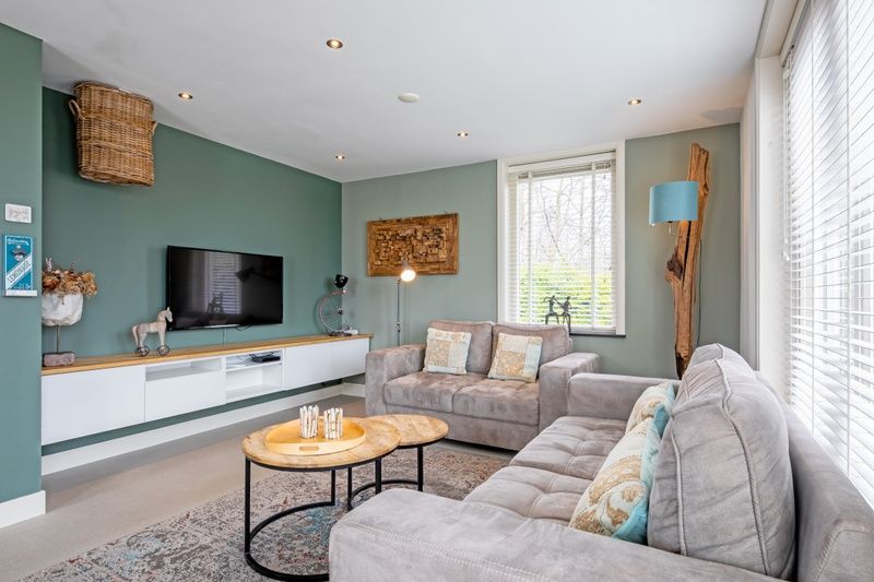 Gemuetliches Wohnzimmer im Bungalow Postweg 109, De Cocksdorp, Texel. Gemuetliche Sitzecke, ideal zum Entspannen auf den Watteninseln.