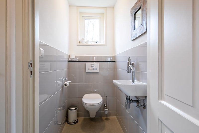 Modernes Badezimmer im Bungalow Postweg 109, De Cocksdorp, Texel, Watteninseln, Ferienhaus mit stilvoller Ausstattung.