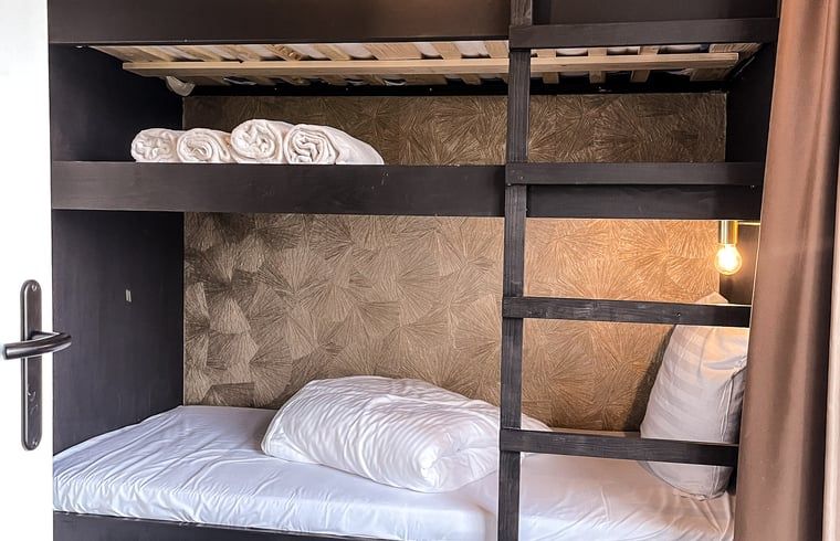 Gemuetliche Etagenbetten im Ferienhaus in De Cocksdorp, Texel, ideal fuer Kinder auf den Watteninseln.