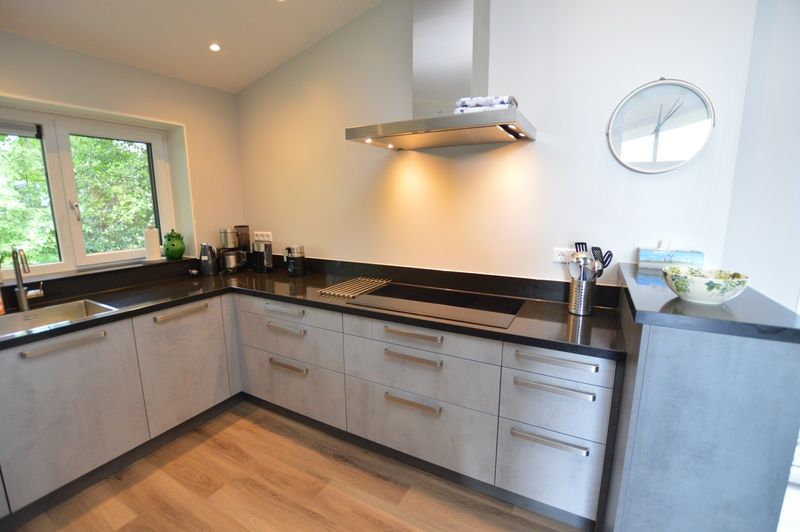 Modern kitchen of Orchismient 49 vacation home in De Koog, Texel with clean lines and high-quality appliances.