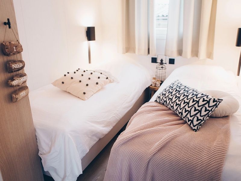 Bedroom with double bed in Chalet Bregkoog 119, Texel, De Koog, for a relaxing stay.