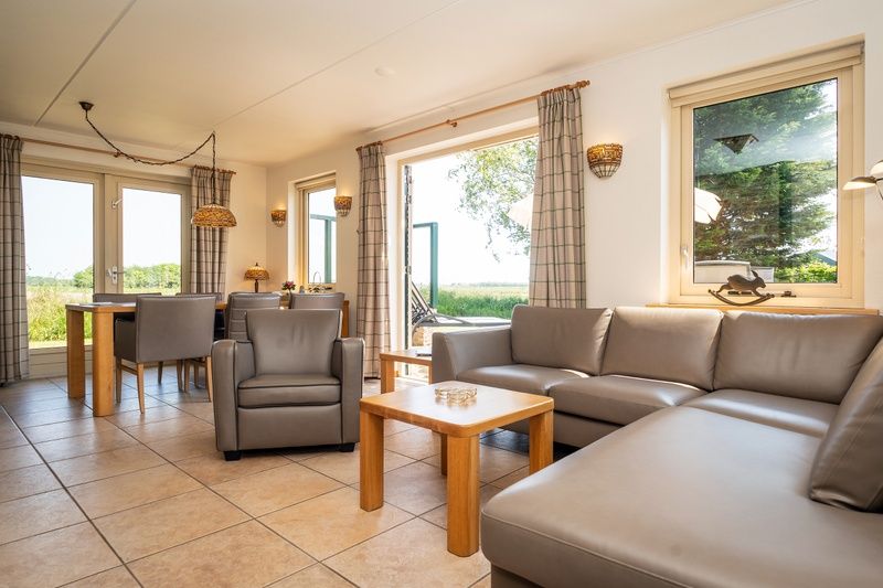 Bright and spacious indoor space in Villa, De Koog, Texel overlooking the nature of the Wadden Islands.