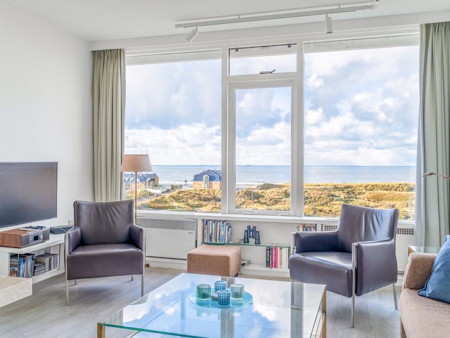 Apartment Juliana 160 Zeezicht in De Koog, Texel offers a beautiful view of the sea from the comfortable living room.
