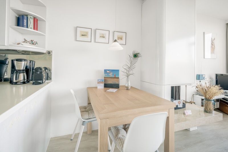 Dining area in Apartment Juliana 160 Zeezicht, a vacation home in De Koog, Texel, with cozy furnishings.
