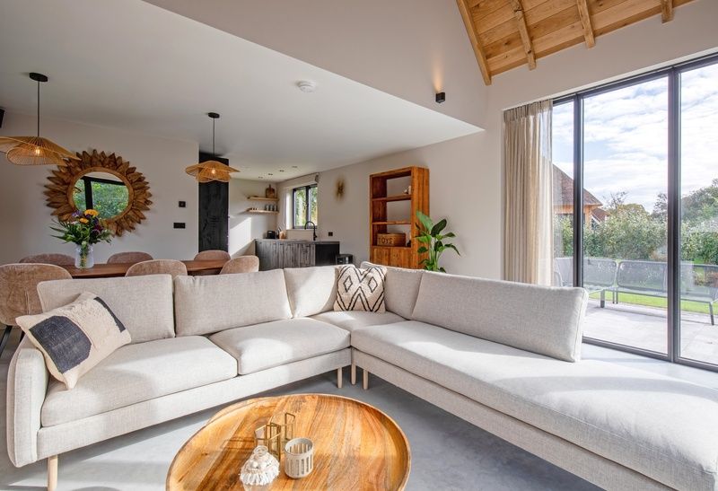 Cozy sitting area in Villa Flo, vacation accommodation on Texel overlooking nature.