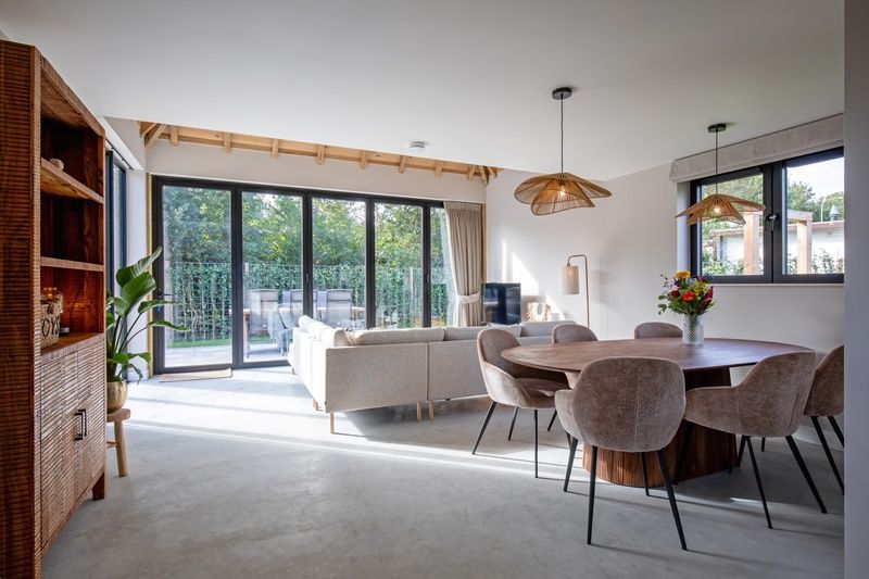 Dining area in Villa Flo, De Koog, Texel with modern dining area and natural light.