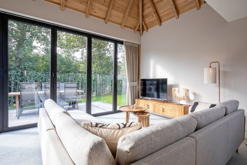 Seating area of Villa Flo, De Koog, Texel overlooking the terrace and garden.