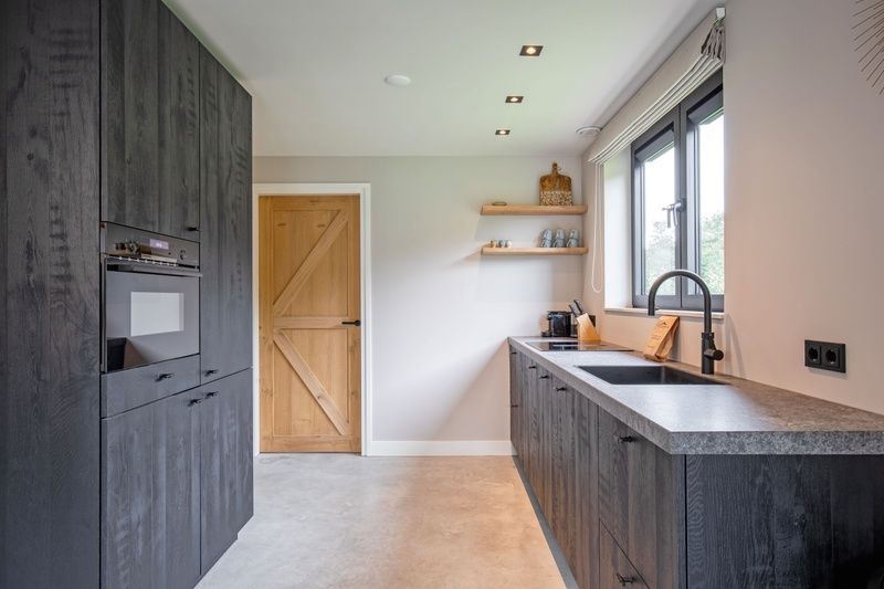 Modern kitchen of Villa Flo, vacation home in De Koog, Texel with luxury appliances.