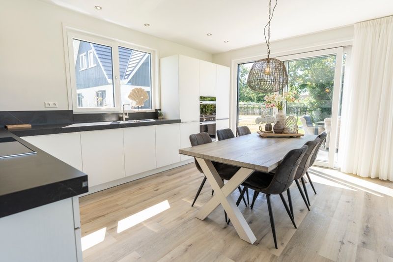Spacious kitchen in Villa 35a, De Koog, Texel overlooking the garden.