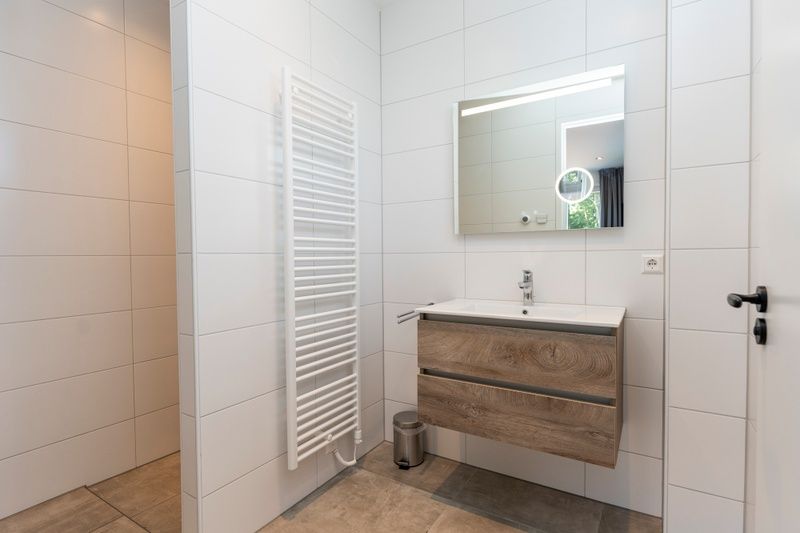 Modern bathroom in Villa 35a, De Koog, Texel with stylish sink.