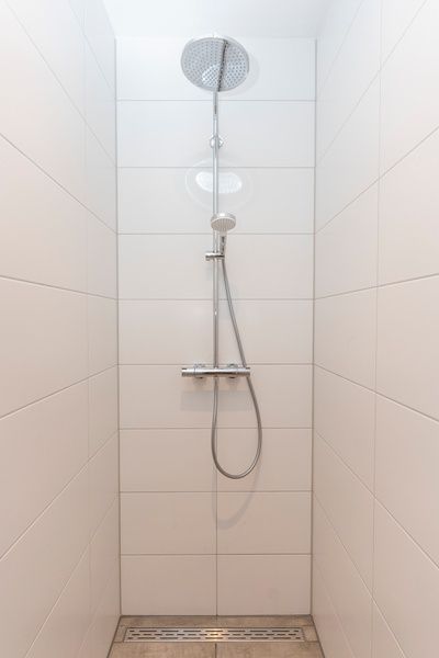 Walk-in shower in Villa 35a, De Koog, Texel with sleek design.