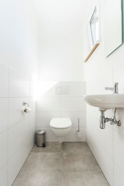 Minimalist toilet in Villa 35a, De Koog, Texel with lots of light.