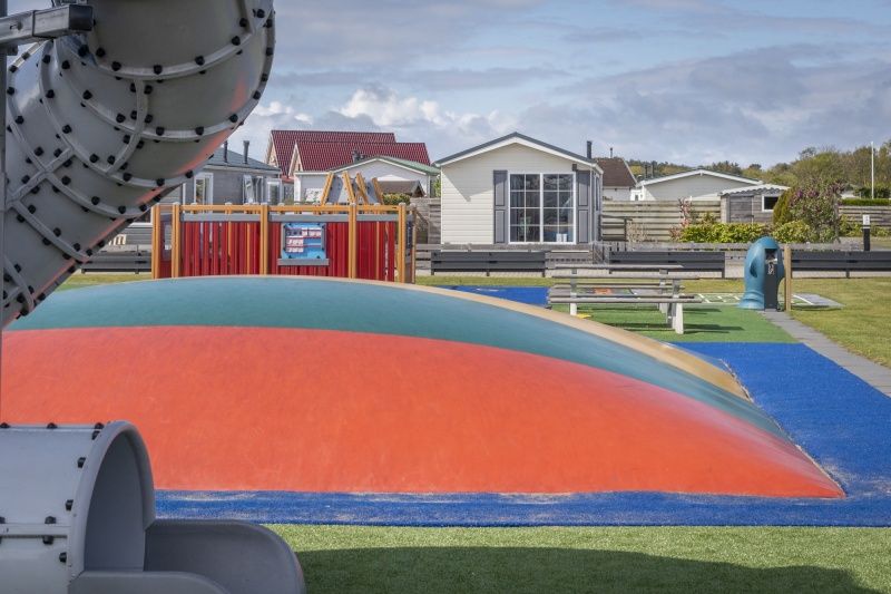 Playground at Chalet Bregkoog 227, Chaletpark Bregkoog, De Koog, Texel with colorful play equipment for children.