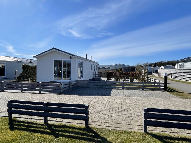 Sunny terrace at Chalet Bregkoog 227, Chaletpark Bregkoog, De Koog, Texel overlooking the peaceful surroundings.