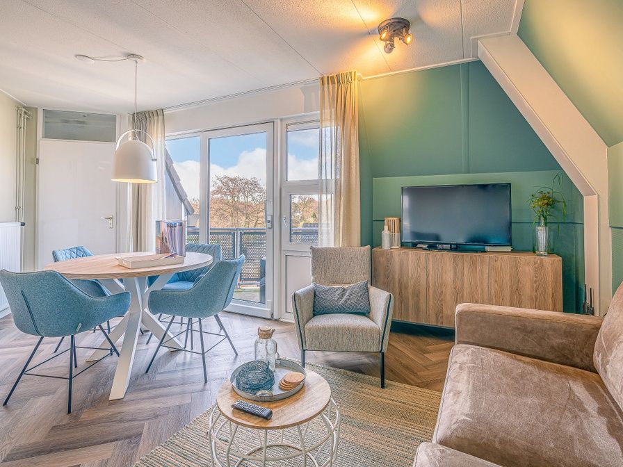 Cozy living room in Apartment Zeedistel 22, De Koog, Texel with modern interior and lots of light.