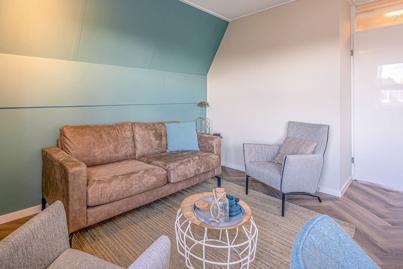 Spacious living room in Apartment Zeedistel 22, De Koog, Texel with modern furniture and cozy decor.