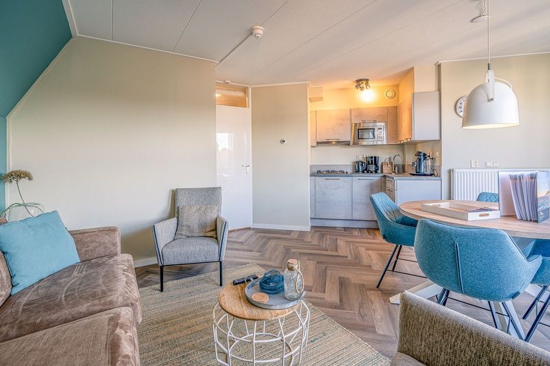 Open kitchen and dining area in Apartment Zeedistel 22, De Koog, Texel with complete amenities.
