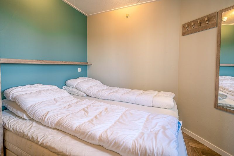 Stylish bathroom in Apartment Zeedistel 22, De Koog, Texel with walk-in shower and modern plumbing.