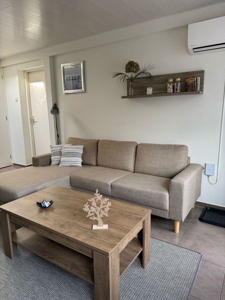 Comfortable living room in Duo bungalow, Texel with stylish decor and modern furniture.