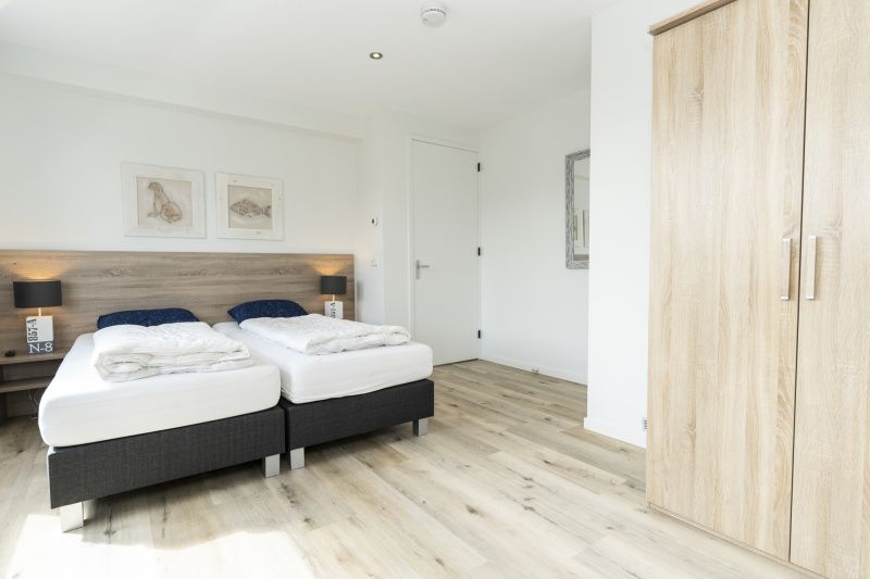 Large bedroom with double bed in Villa 21A, De Koog, Texel, vacation home on the Wadden Islands.