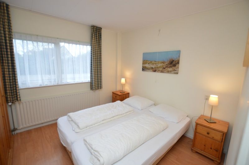 Master bedroom in Epelaan 19, De Koog, Texel, with double bed and restful atmosphere.