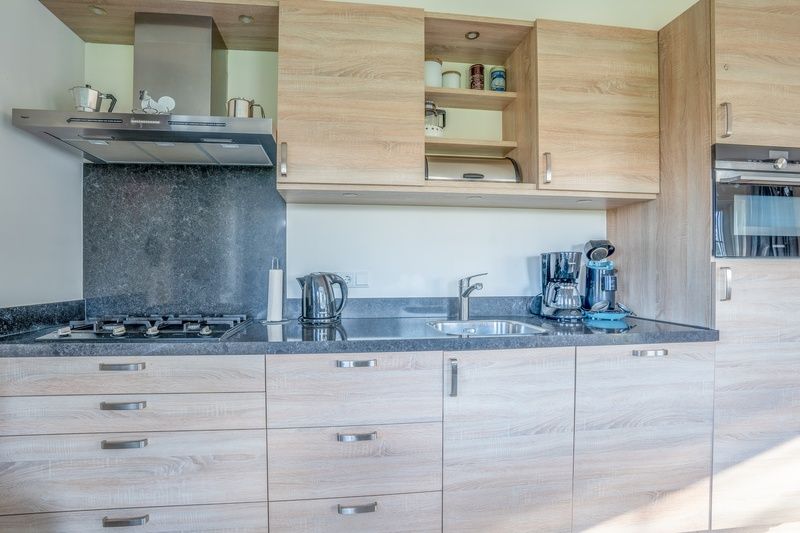 Modern kitchen in Maaikeduinweg 13 vacation home, De Koog, Texel equipped with all conveniences for a comfortable stay.