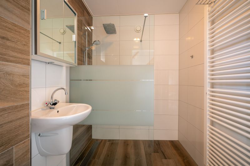Stylish bathroom with walk-in shower in vacation home Maaikeduinweg 13, De Koog, Texel for ultimate comfort on the Wadden Islands.