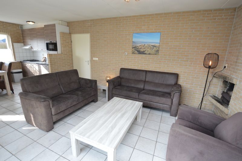 Spacious open kitchen and sitting area in Holiday home Stappeland 207, De Koog, Texel, perfect for family gatherings.