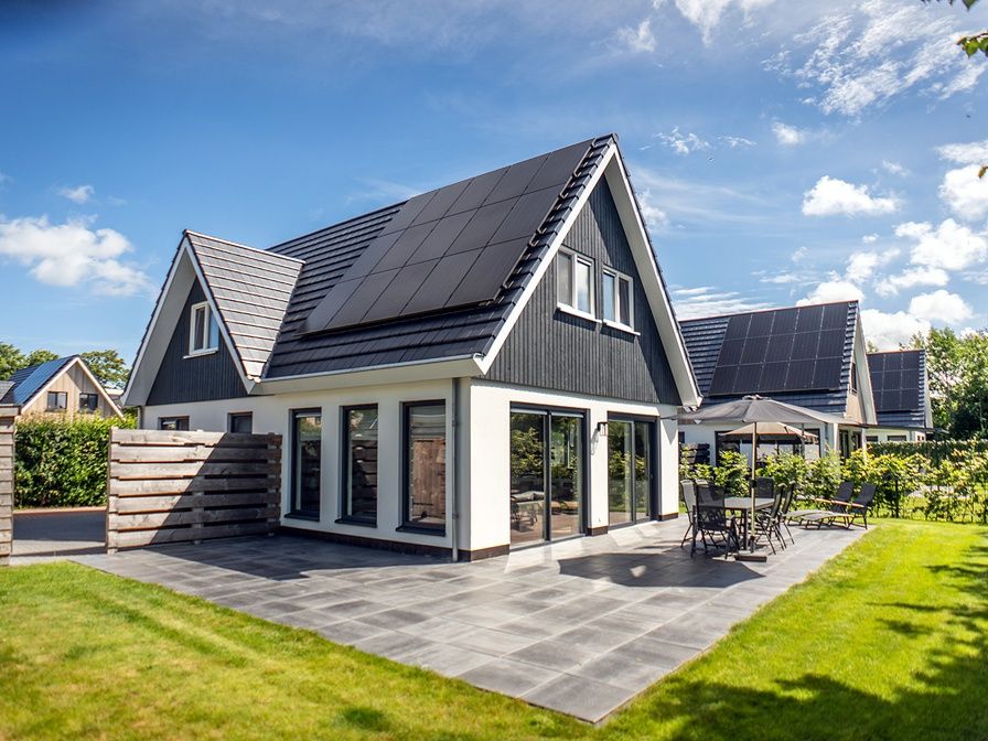 Villa 39 in De Koog, Texel, offers a spacious terrace with modern outdoor space for relaxation on the Wadden Islands.