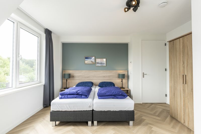 Second bedroom in Villa 39, De Koog, Texel. Cozy vacation home with comfortable beds on the Wadden Islands.