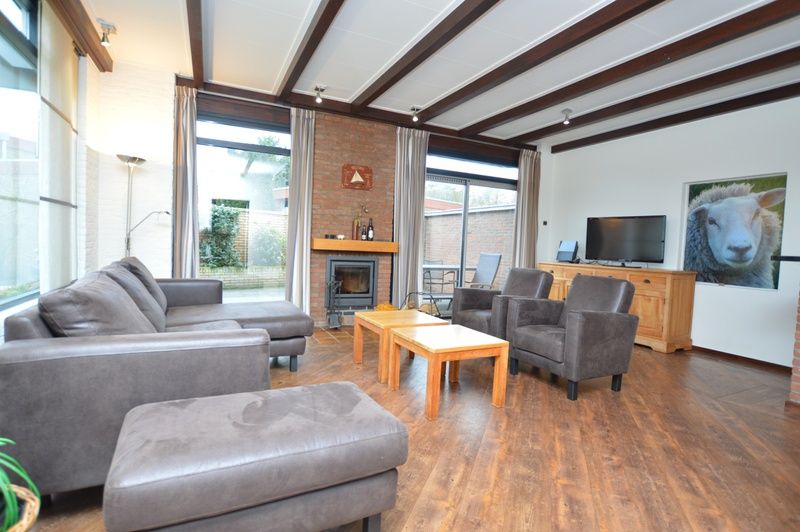 Comfortable sitting area in Orchismient 28 De Koog Texel overlooking the terrace.